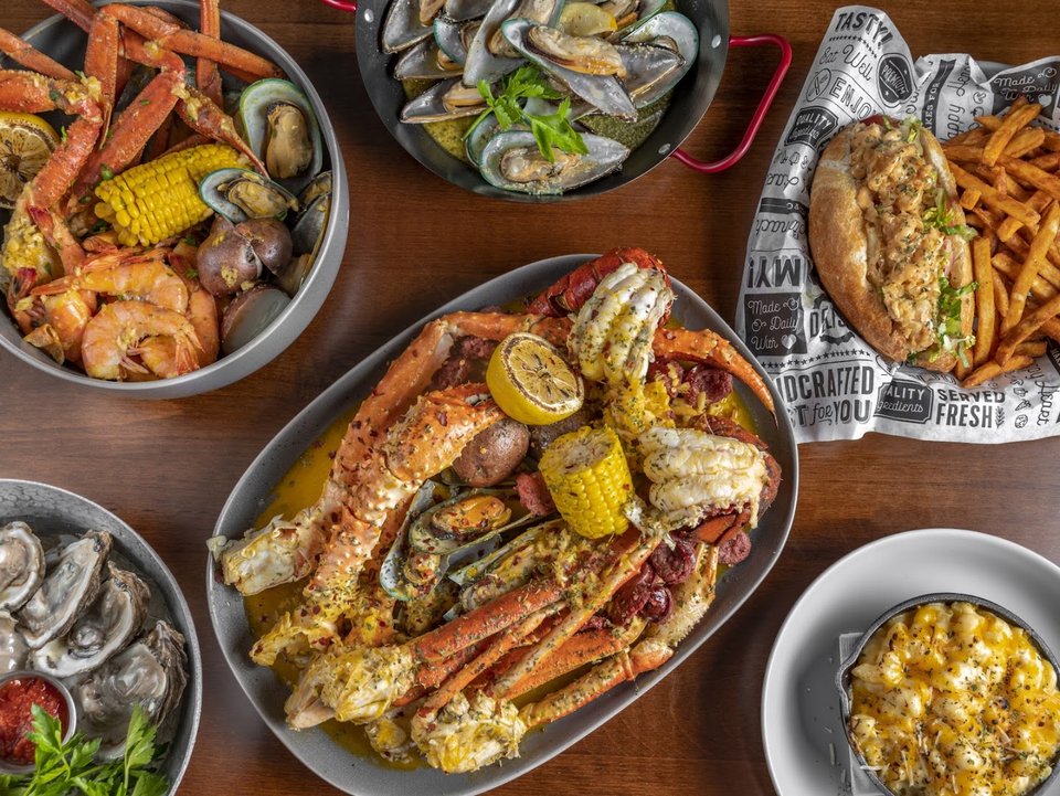 Seafood dishes on a casual restaurant table.